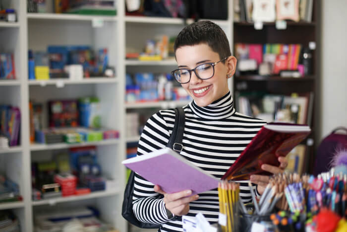 Woman browsing in a shop for stationery.
